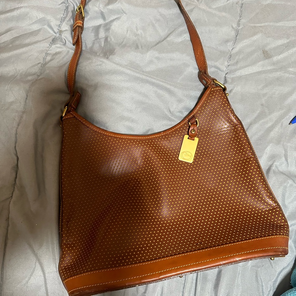 Dooney & Bourke purse is unique in the way it’s designed.